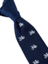 navy blue knitted tie with white embroidered bicycle bike design